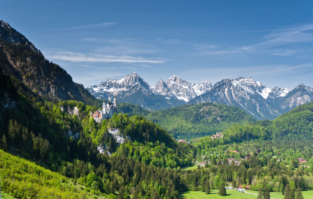 Neuschwanstein and Hohenschwangau castles can be seen against the snow-peaked Alps