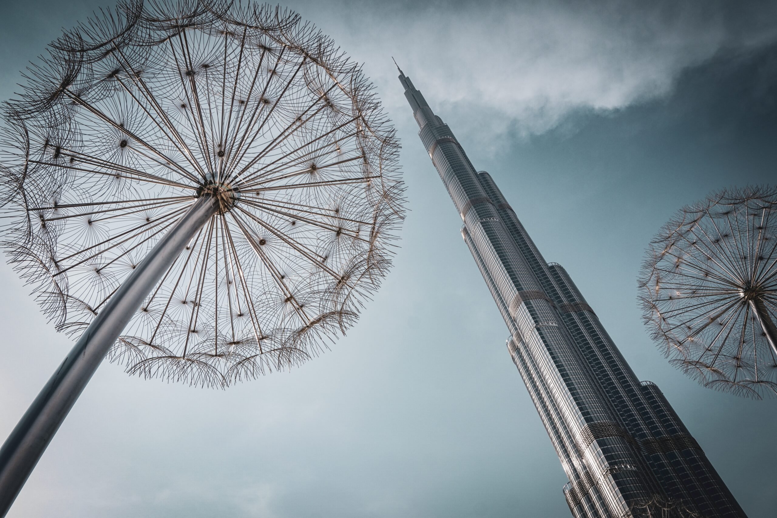 The Burj Khalifa towers over a piece of public art