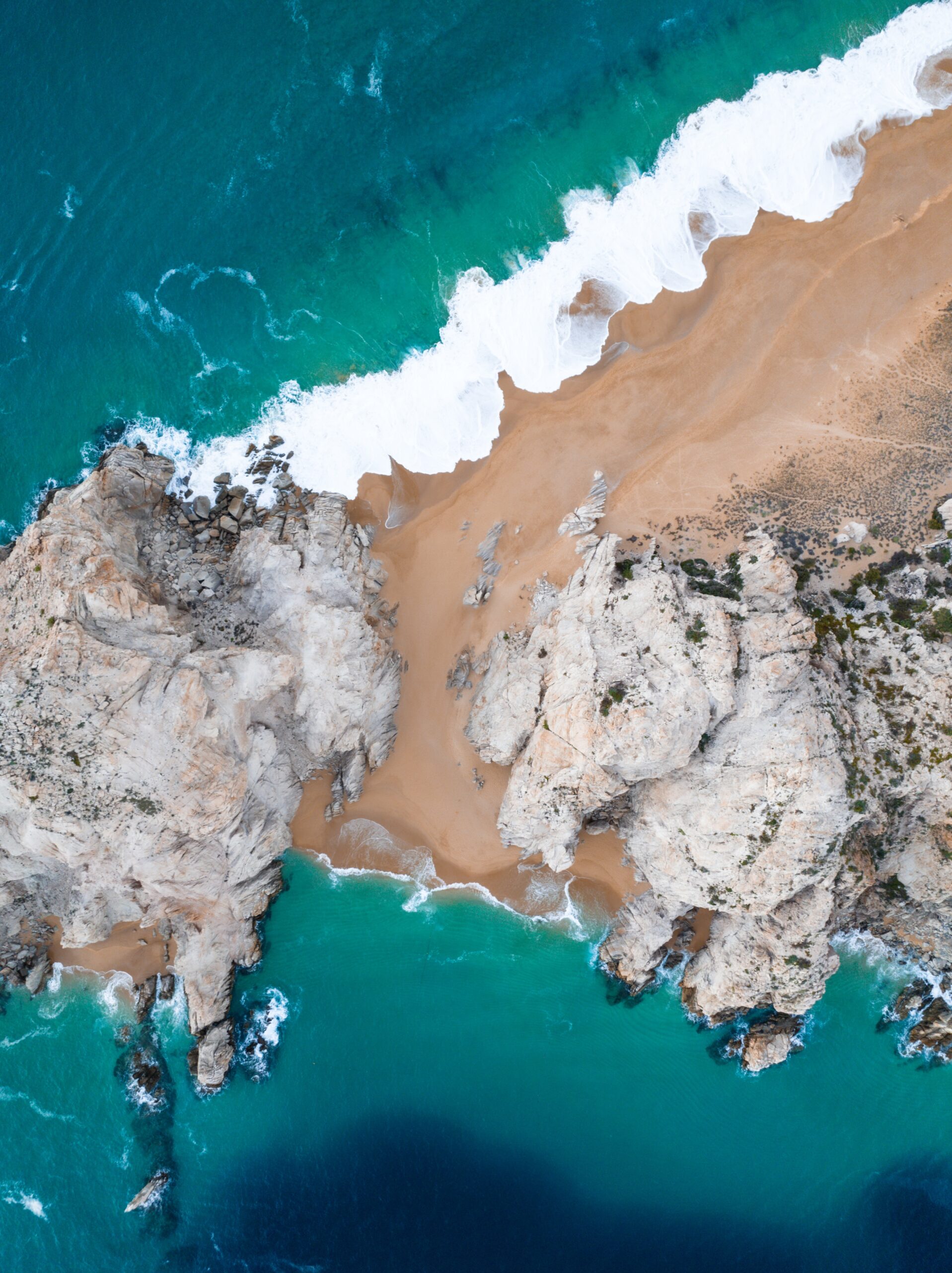 Waves break on Lover's and Divorce Beaches in Baja California