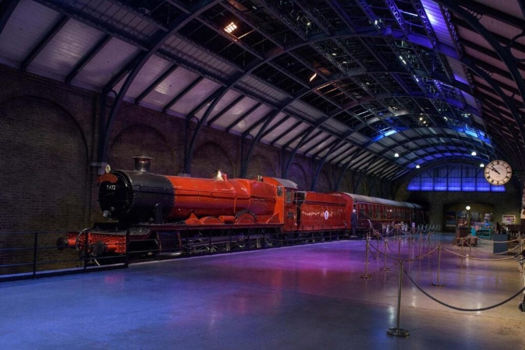 The Hogwarts Express waits at a platform at the Warner Bros. Studio Tour London — The Making of Harry Potter
