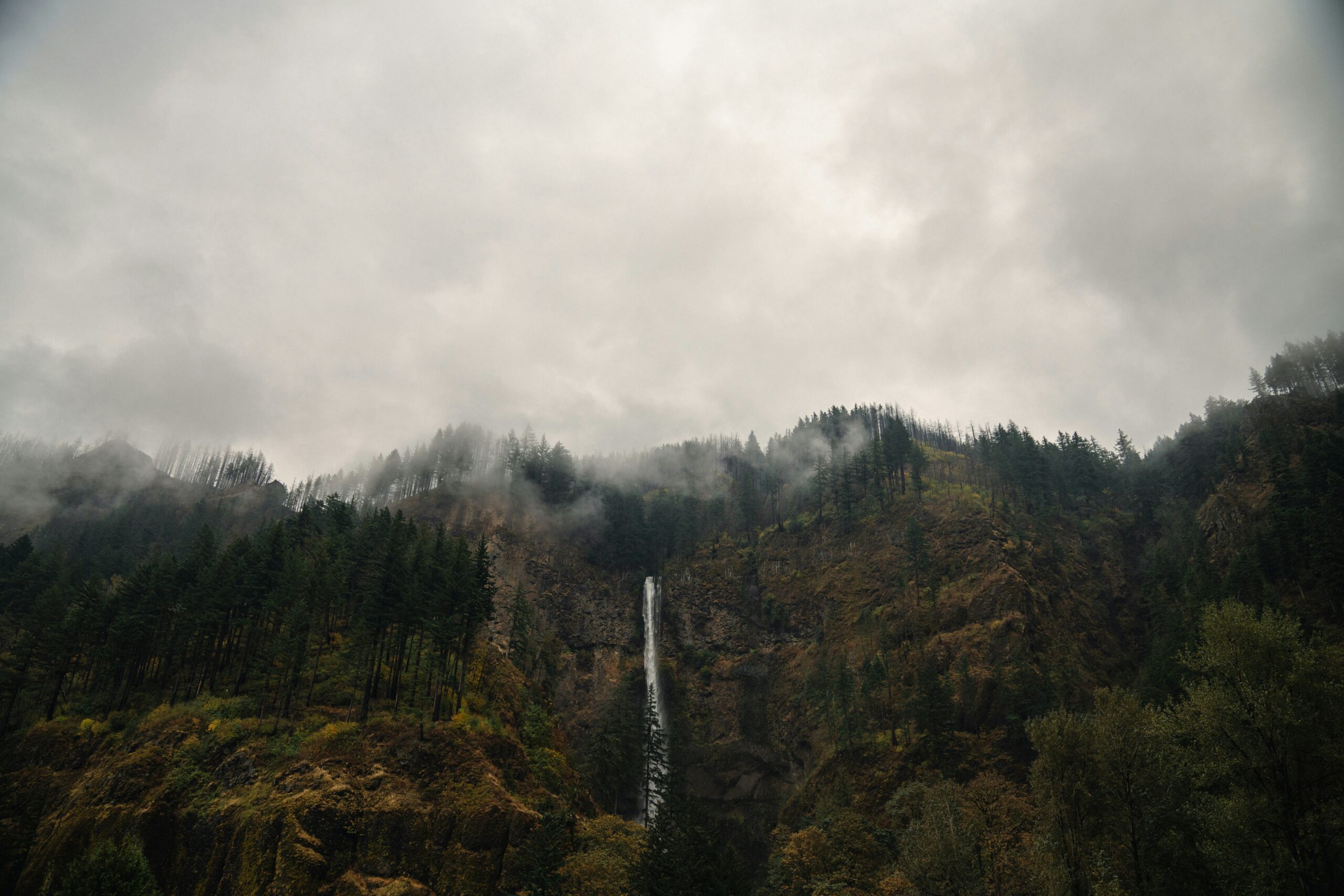 A wide, cloudy shot of Multnomah Falls near Portland, Oregon