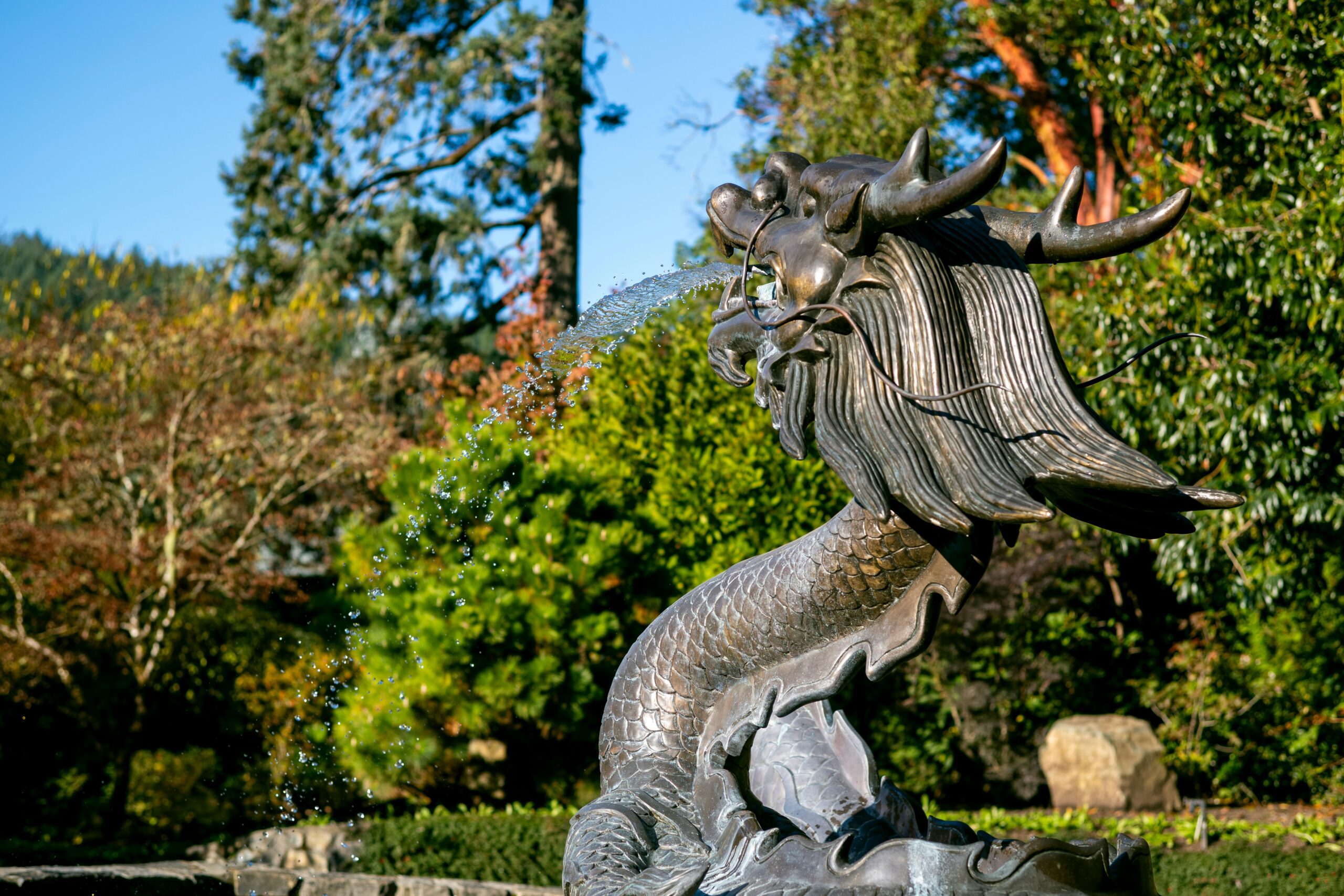 A fountain in the shape of a dragon in the Gardens